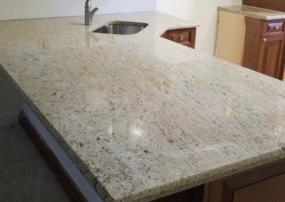 kitchen granite counter top with a light cream color and a non busy soft movement